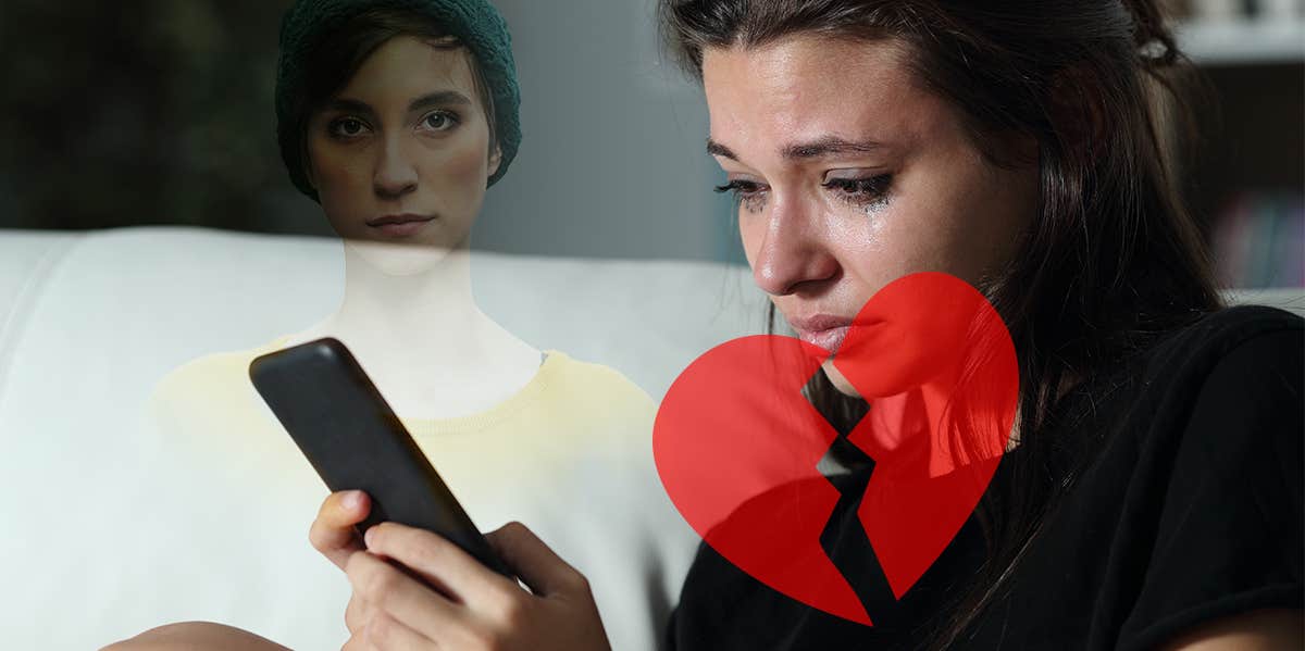 woman looking at phone and crying
