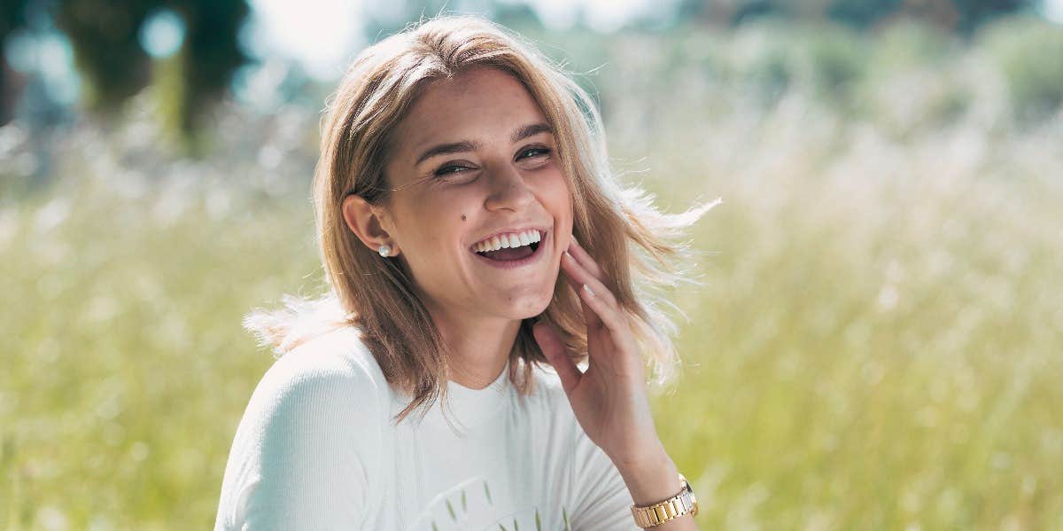 woman with mole on face smiling