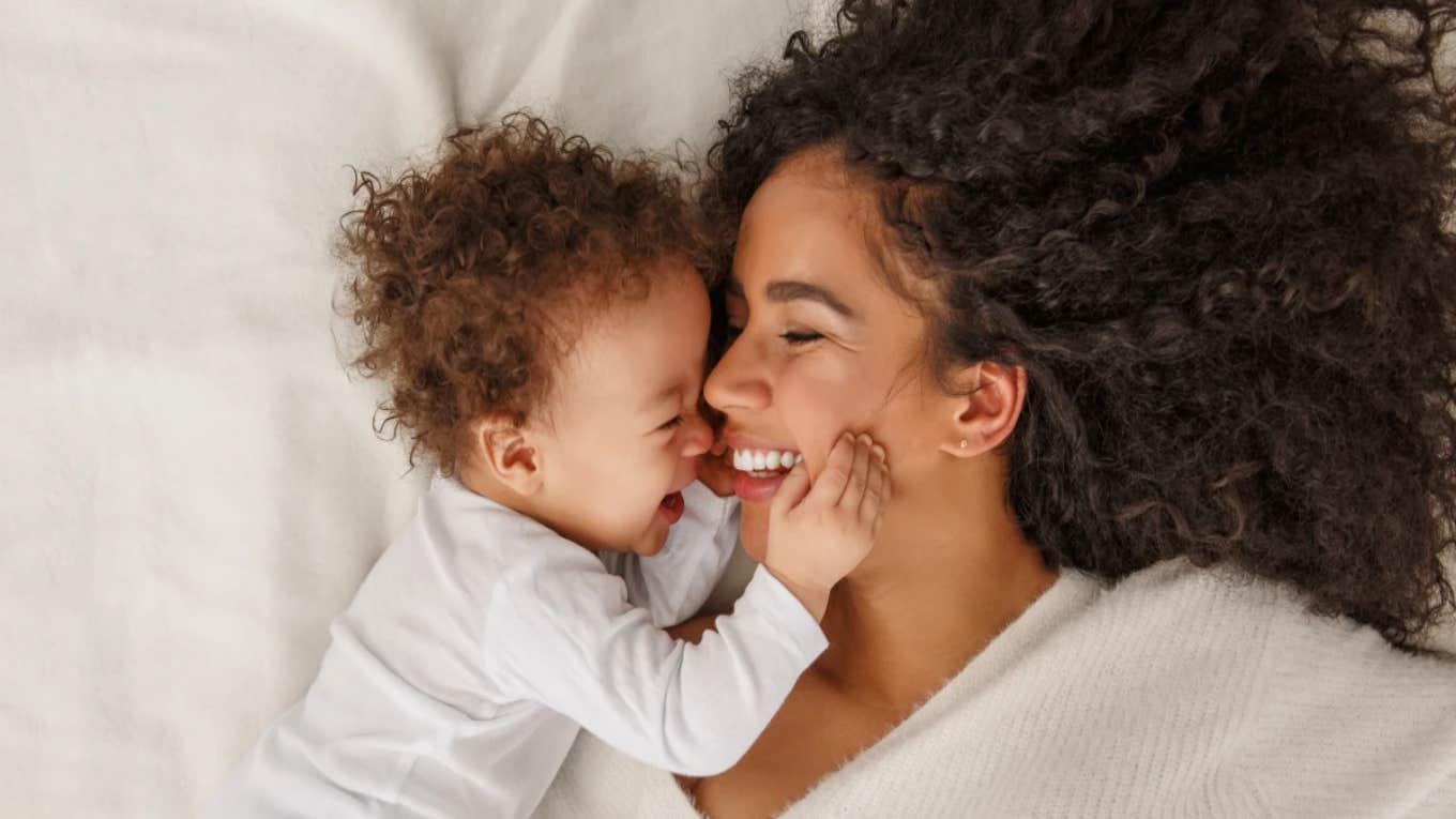 mom cuddling with baby