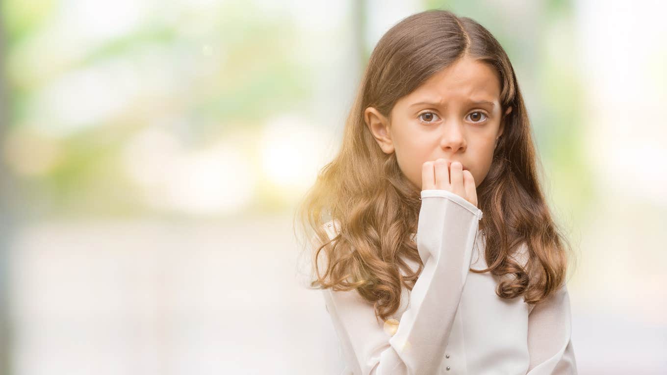 shy young girl looking distressed