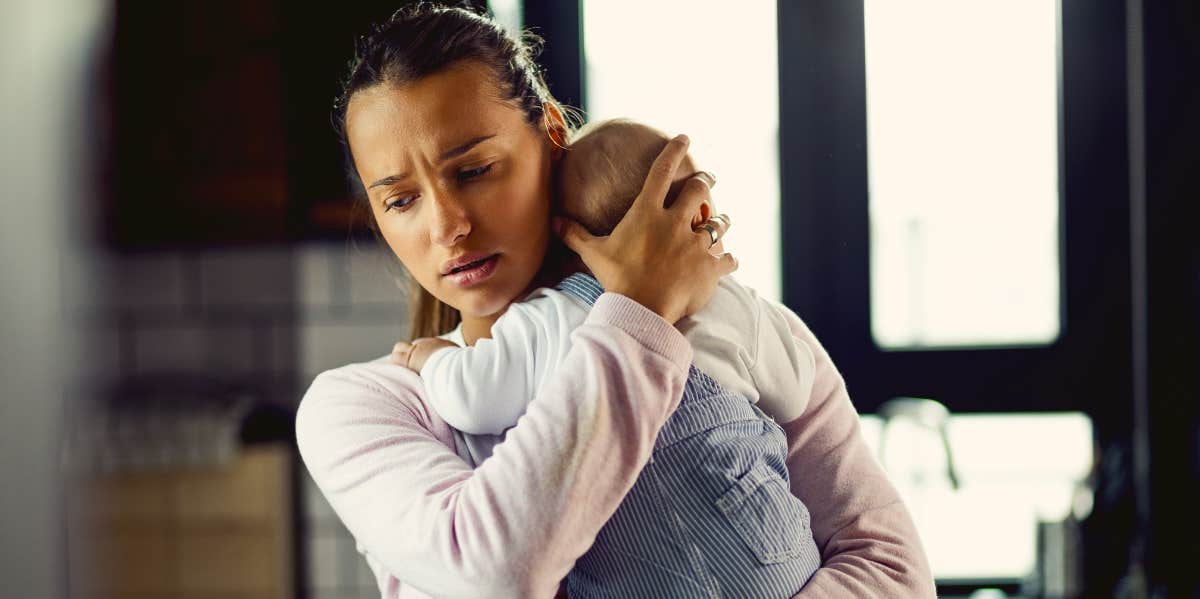 Worried mother with baby