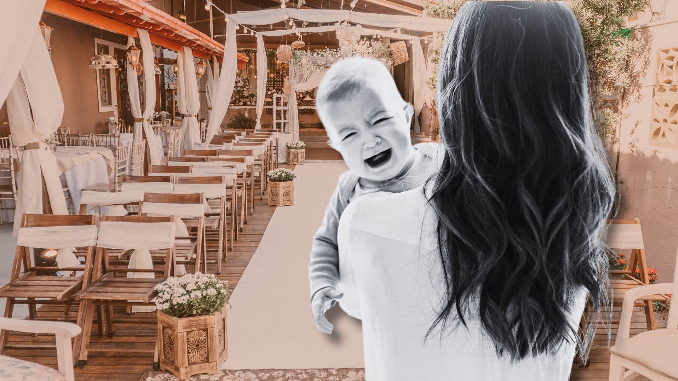 woman holding crying baby in front of wedding ceremony setup