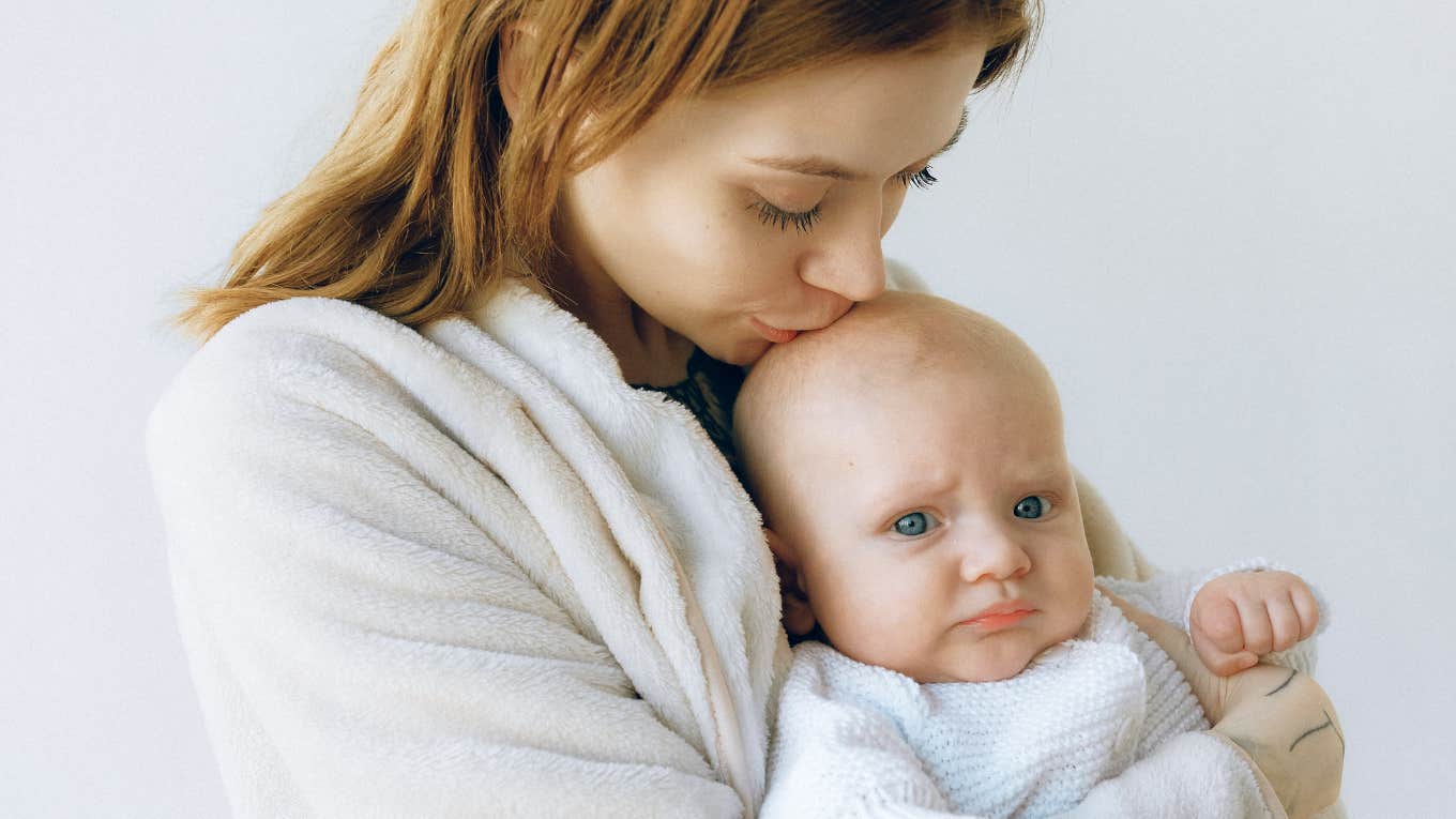 mom holding baby