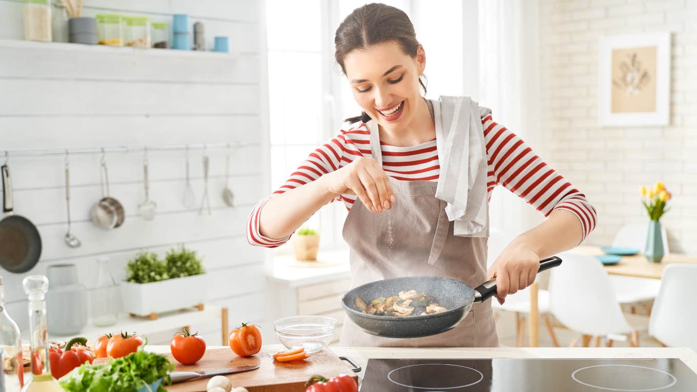 Mom Explains Why She Sometimes Makes A Dinner That No One Else Likes happy mom making dinner