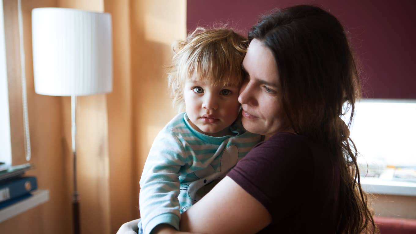 mom holding toddler son