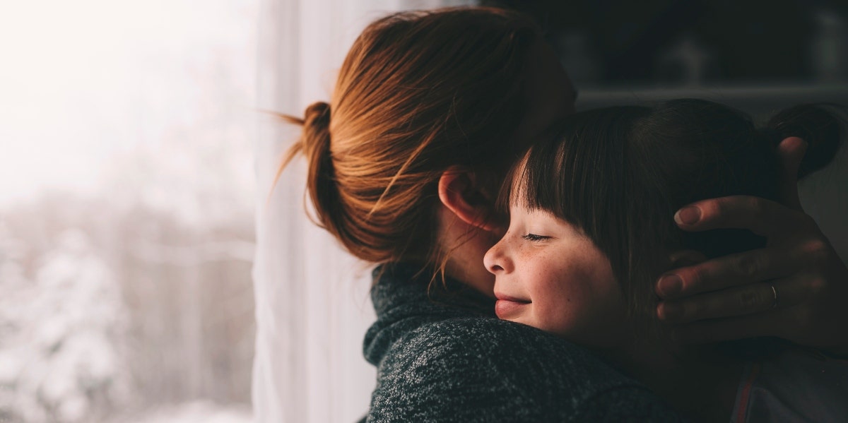 mom hugging child