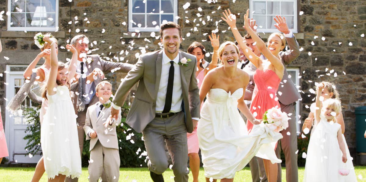 Couple running at a wedding.