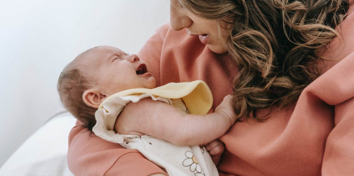 mom with crying newborn baby