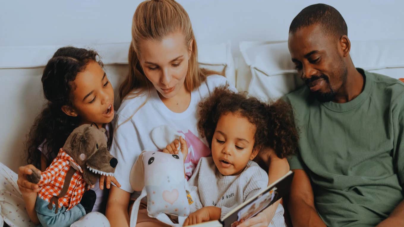 Mom Of Biracial Baby Responds To Comments That She Should Have Genetic Testing Done family looking at photo album