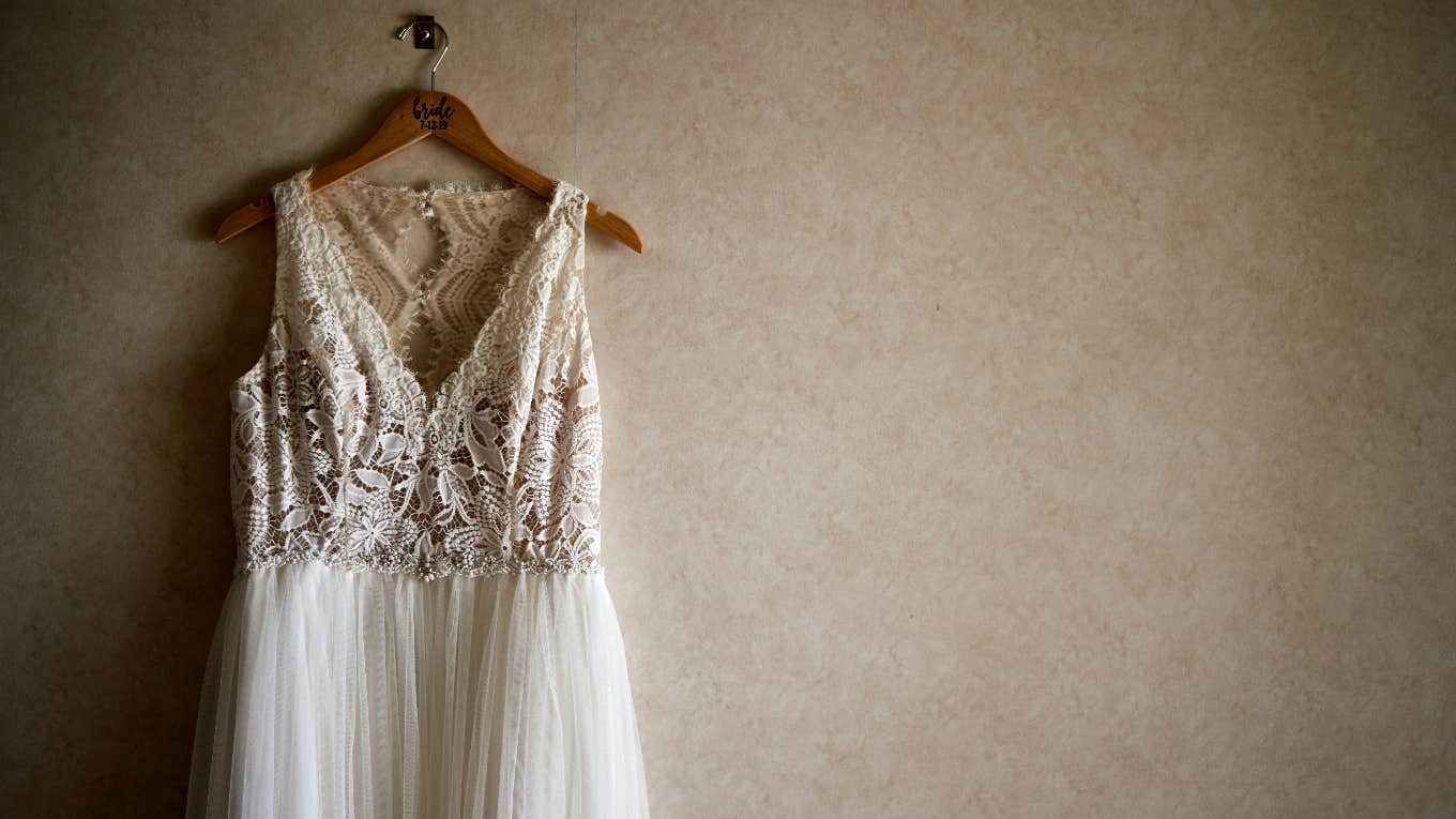 Mom Pays For Stranger’s Wedding Dress But Not Her Daughter’s hanging wedding dress