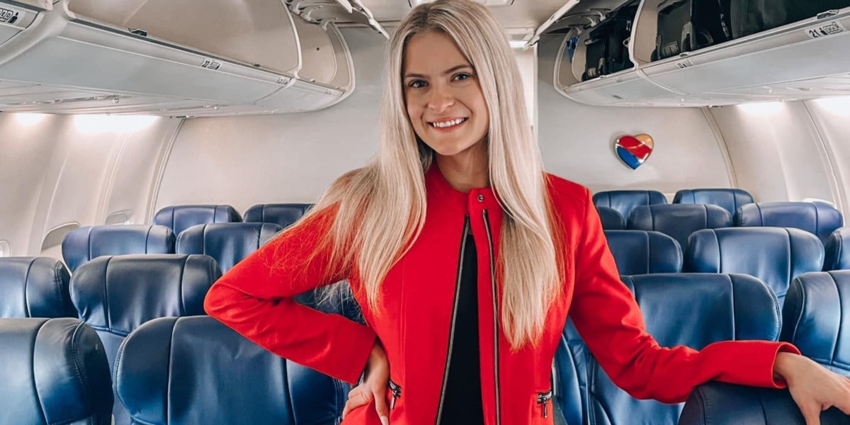 Taylor Jenkins is posing for a photo on an airplane.