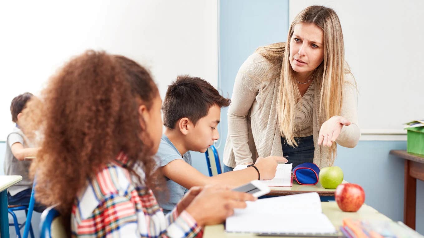 teacher taking students phone during class