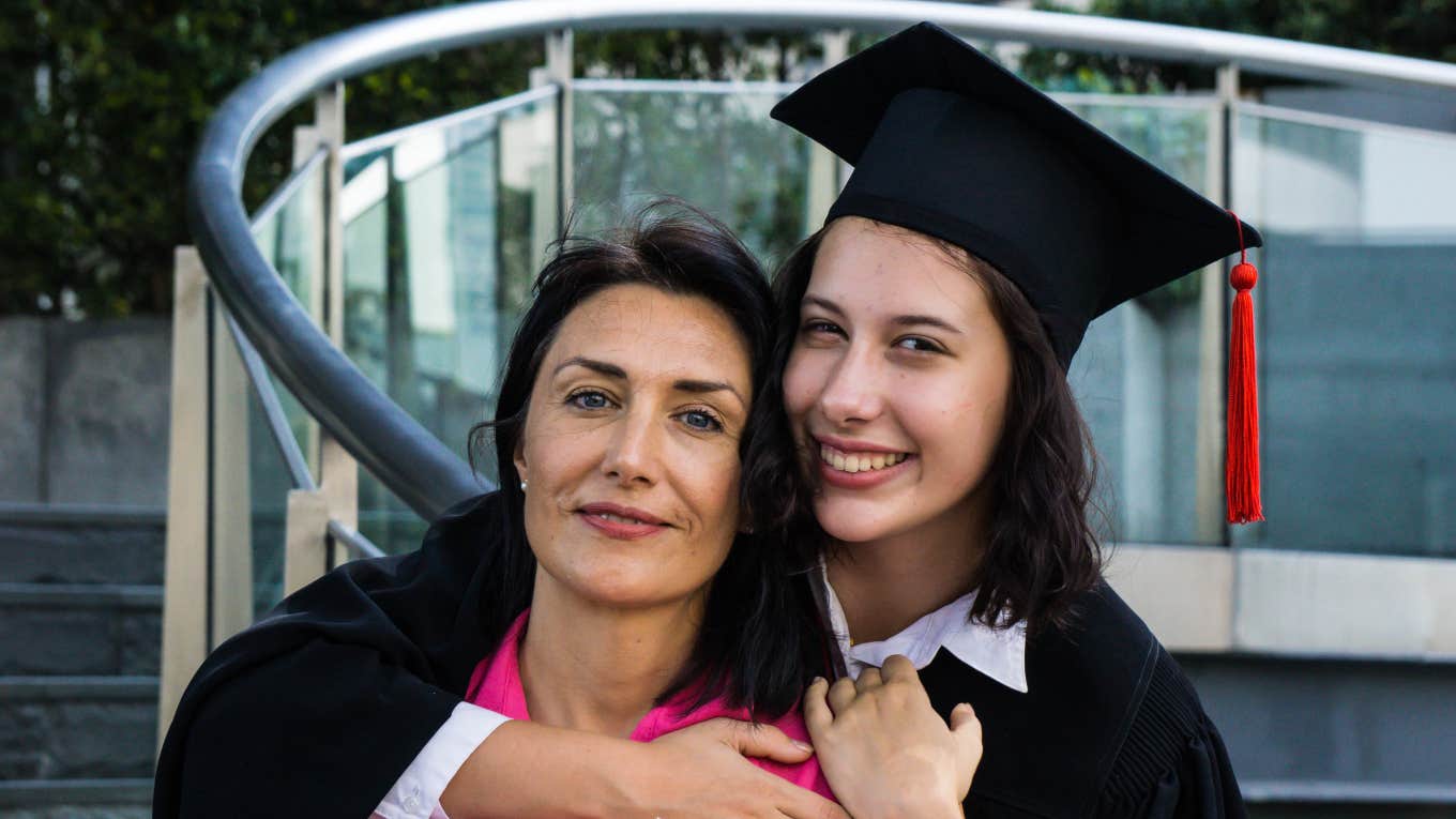 mom and daughter hugging at high school graduation