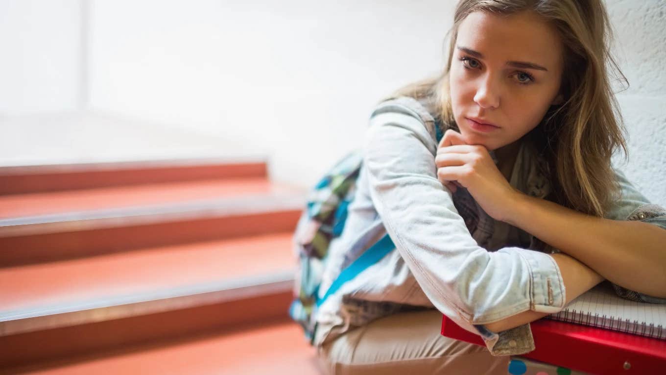 sad student on school steps