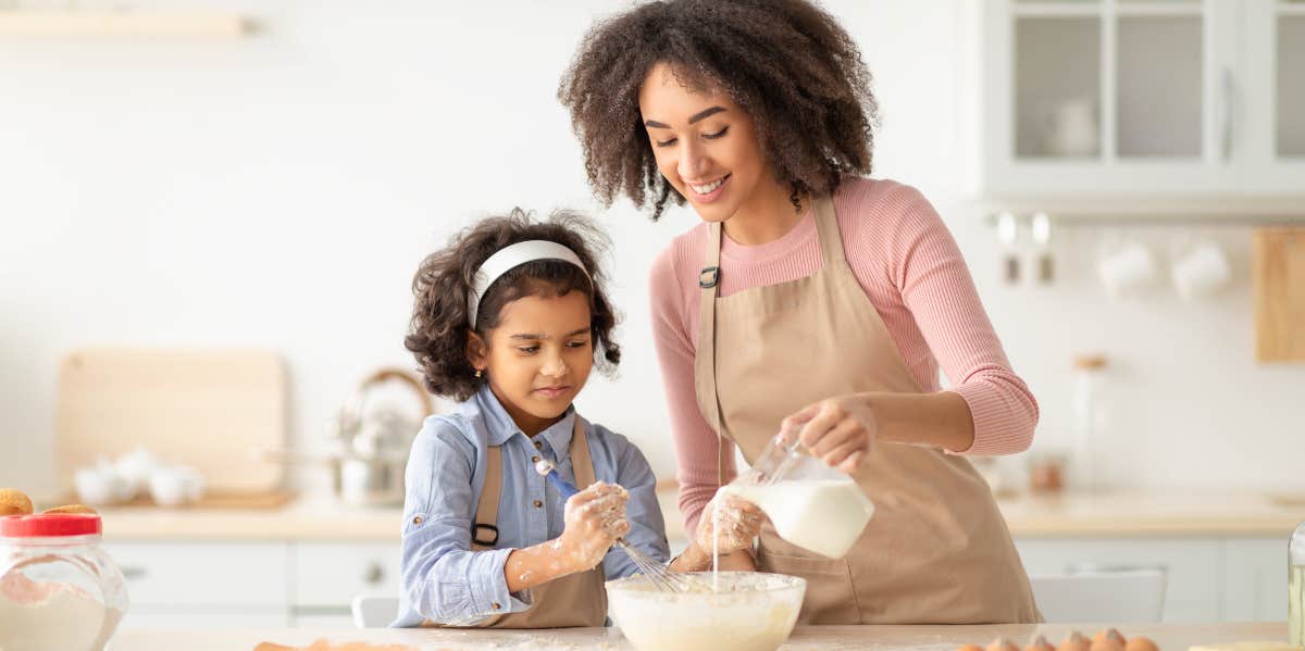 stepmother and daughter baking