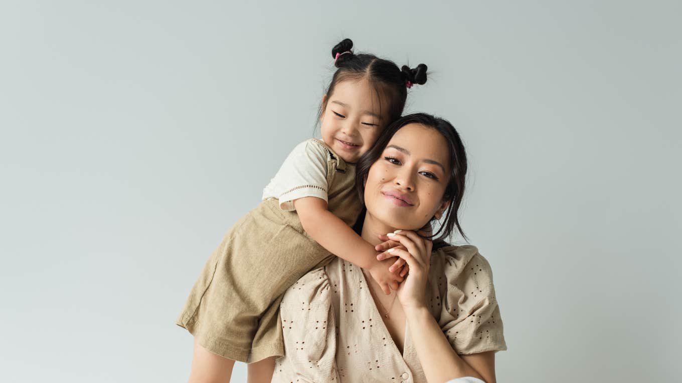 toddler girl hugging her mom