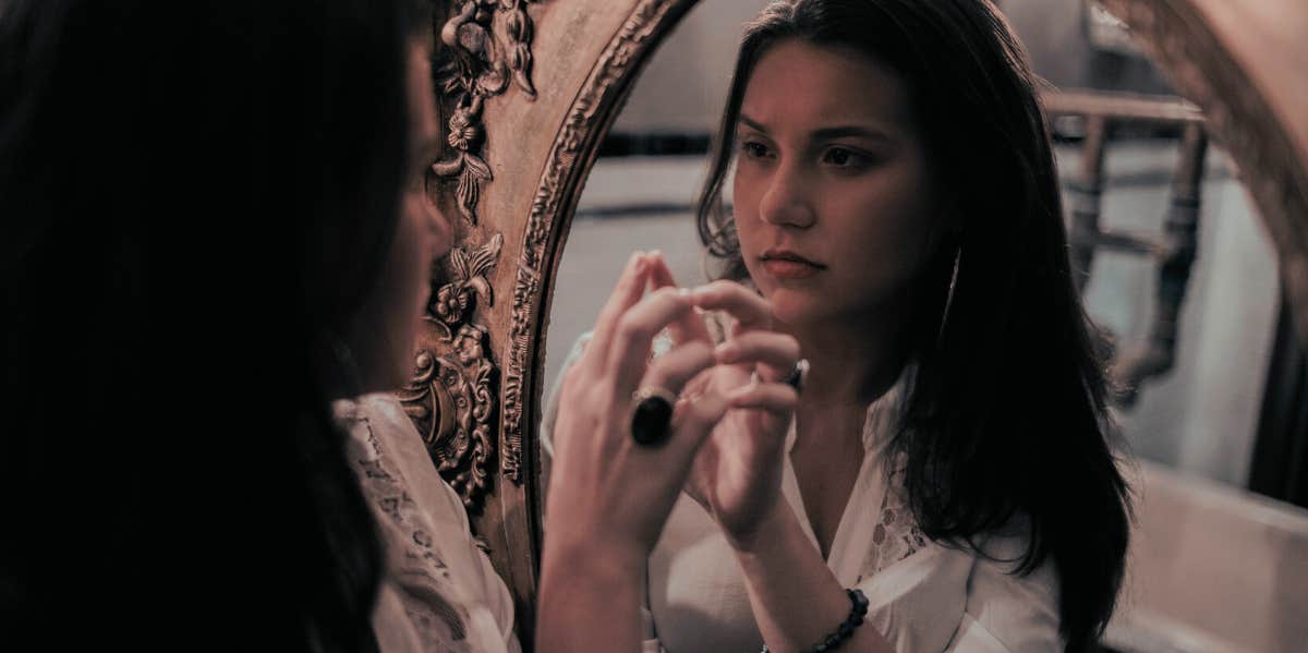 The Monster In The Mirror: The Truth About Hating Your Body woman looking in a mirror