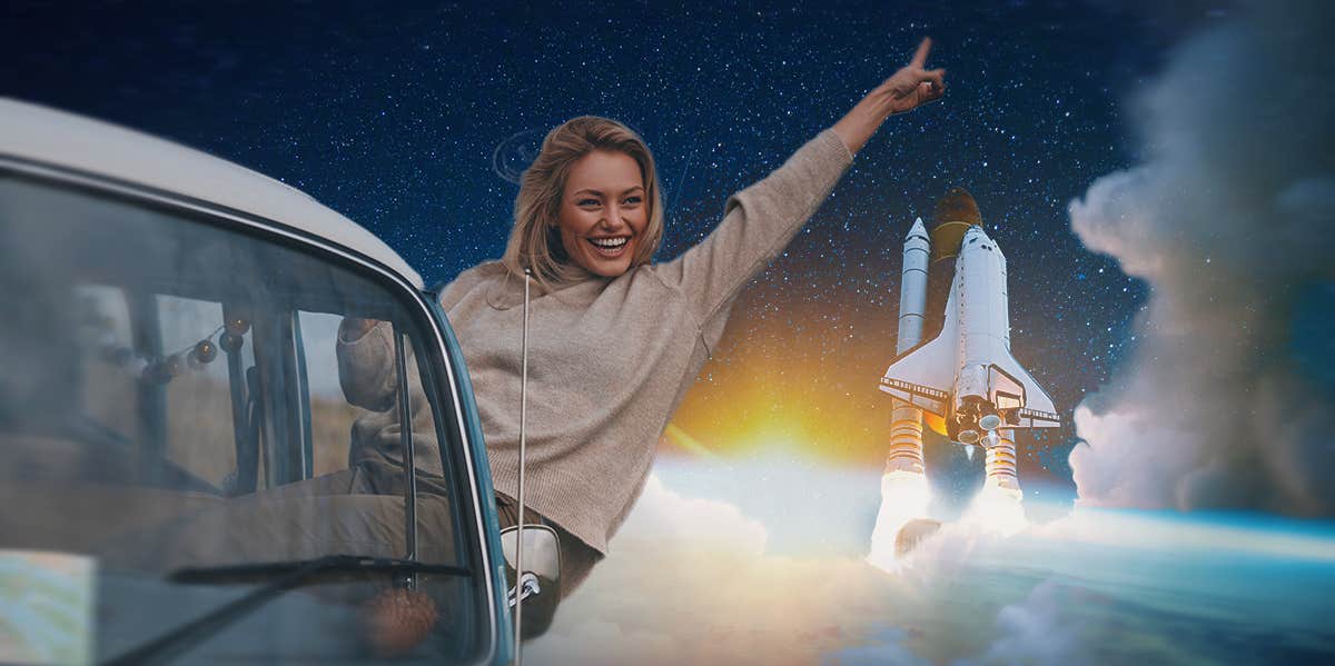 woman in a car with a space ship