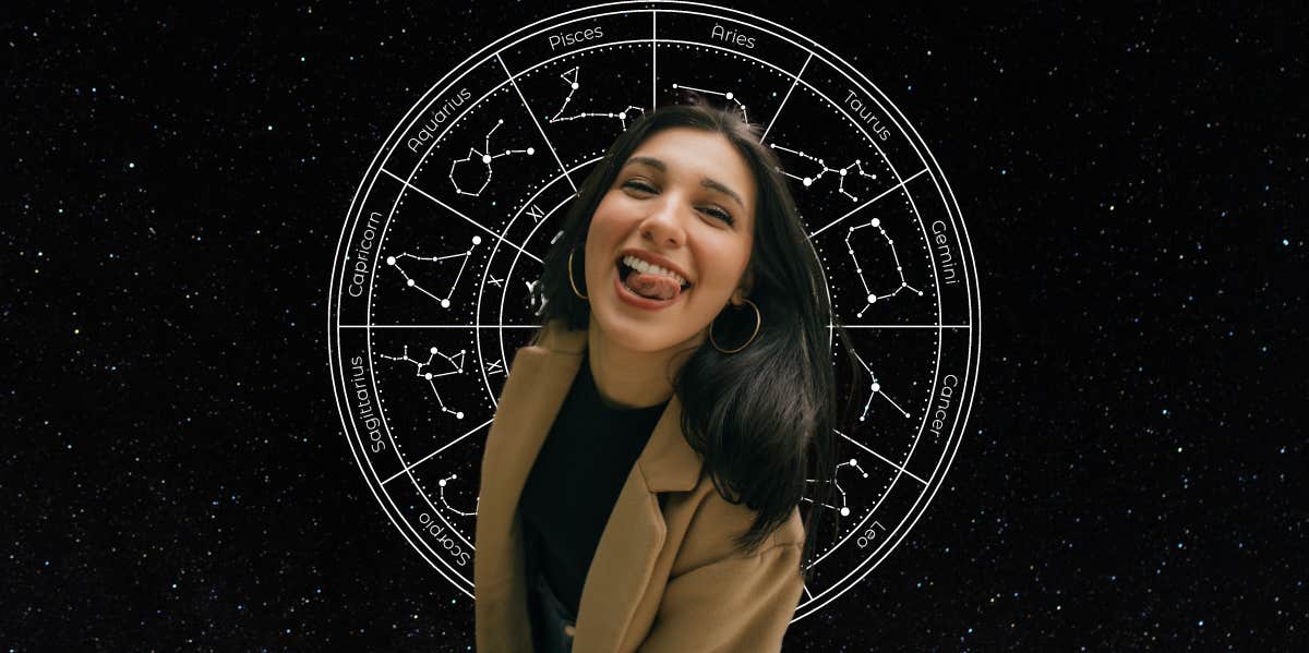 woman laughing in front of zodiac wheel