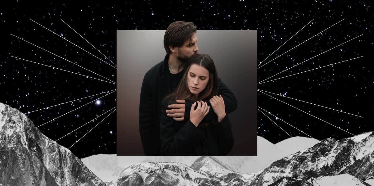 couple embracing, mountain range