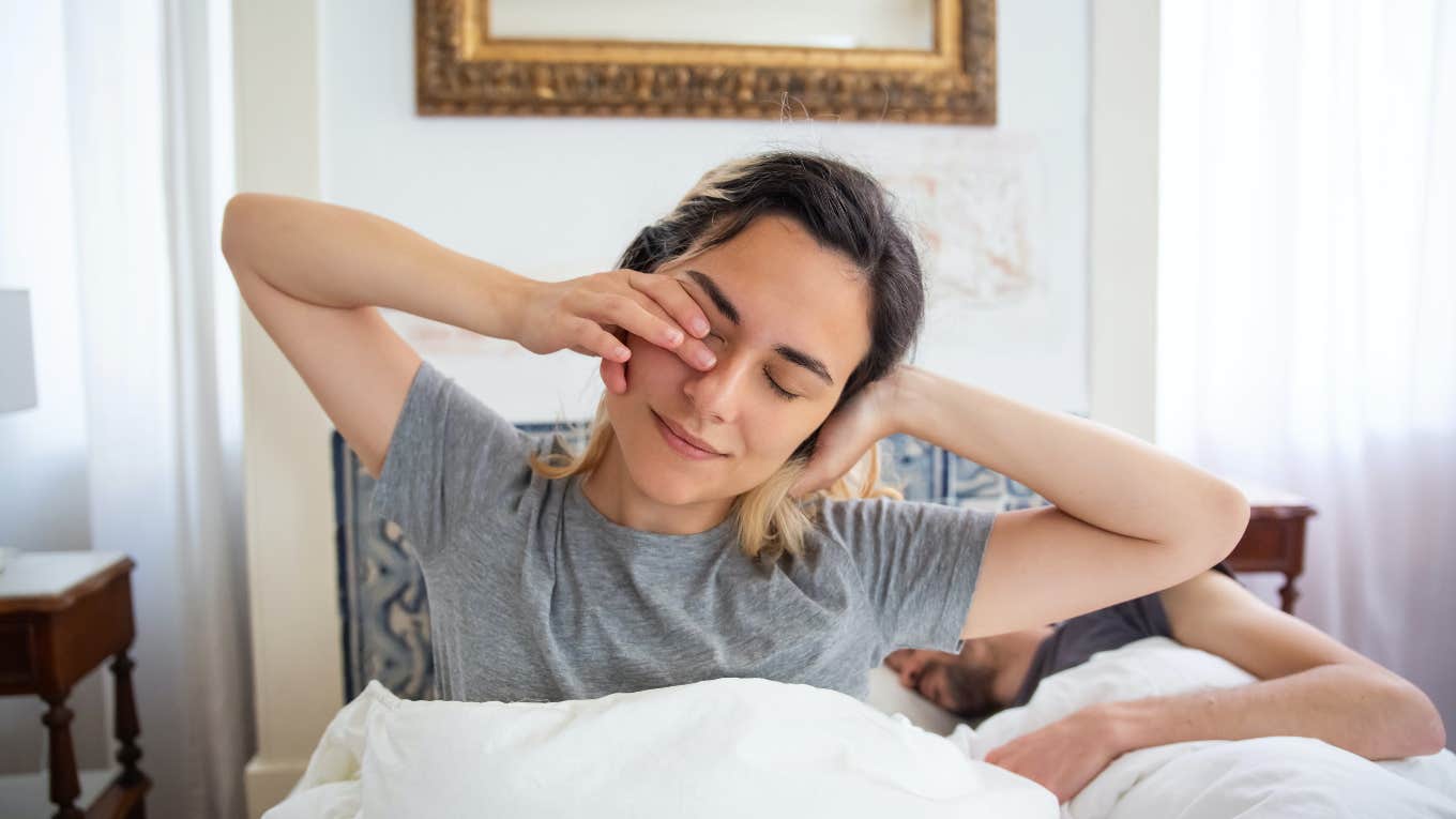 woman waking up in bed