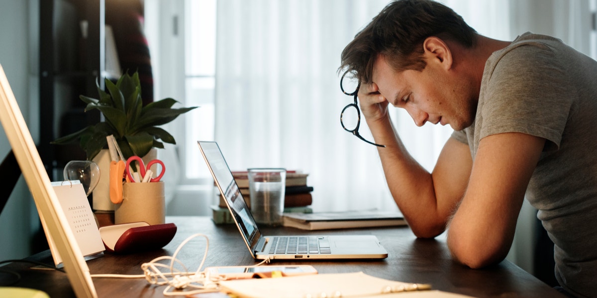 stressed out man at a desk