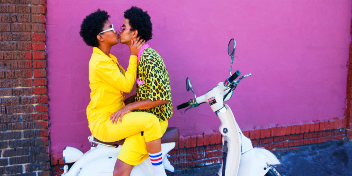 The Most Compatible Signs In Astrology: Top 6 Zodiac Pairs couple kissing on a scooter