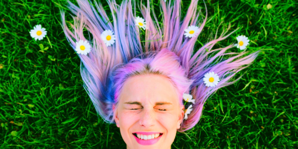 woman with flowers in colorful hair