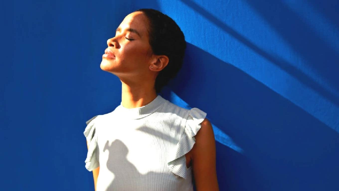 woman looking up at light