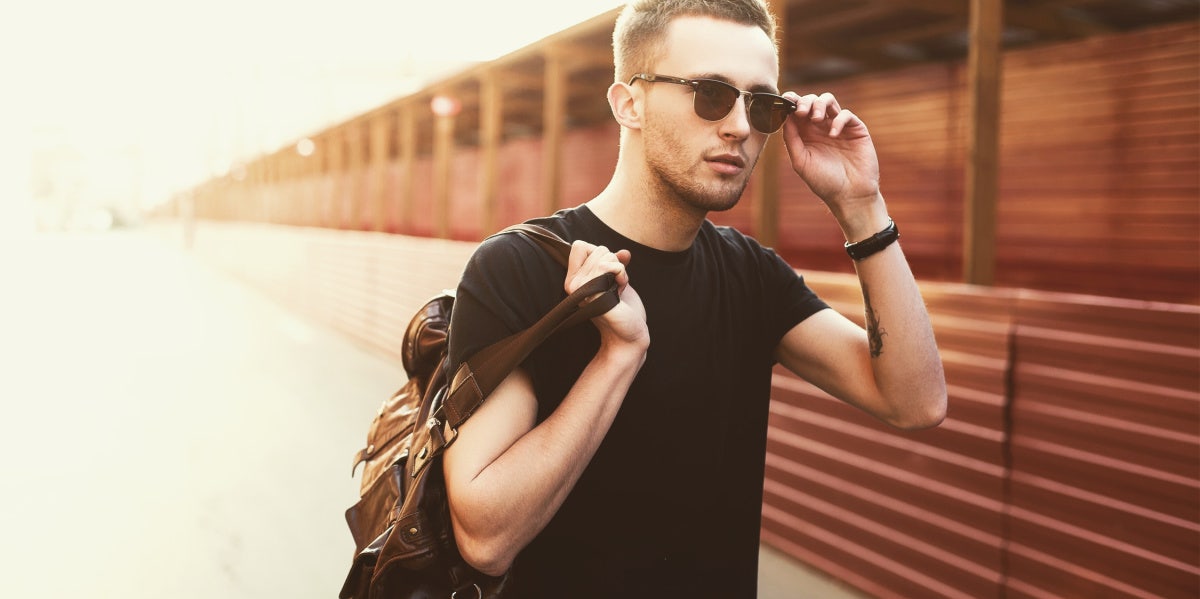 7 Of The Most Self-Absorbed Zodiac Signs In Astrology man with luggage