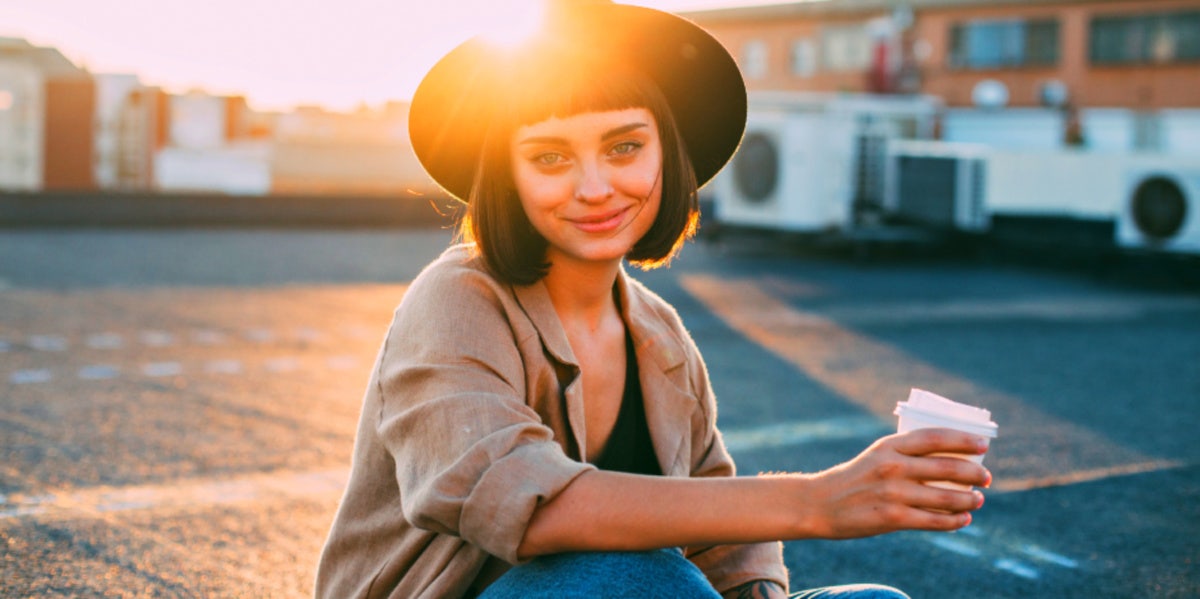 woman smiling with hat