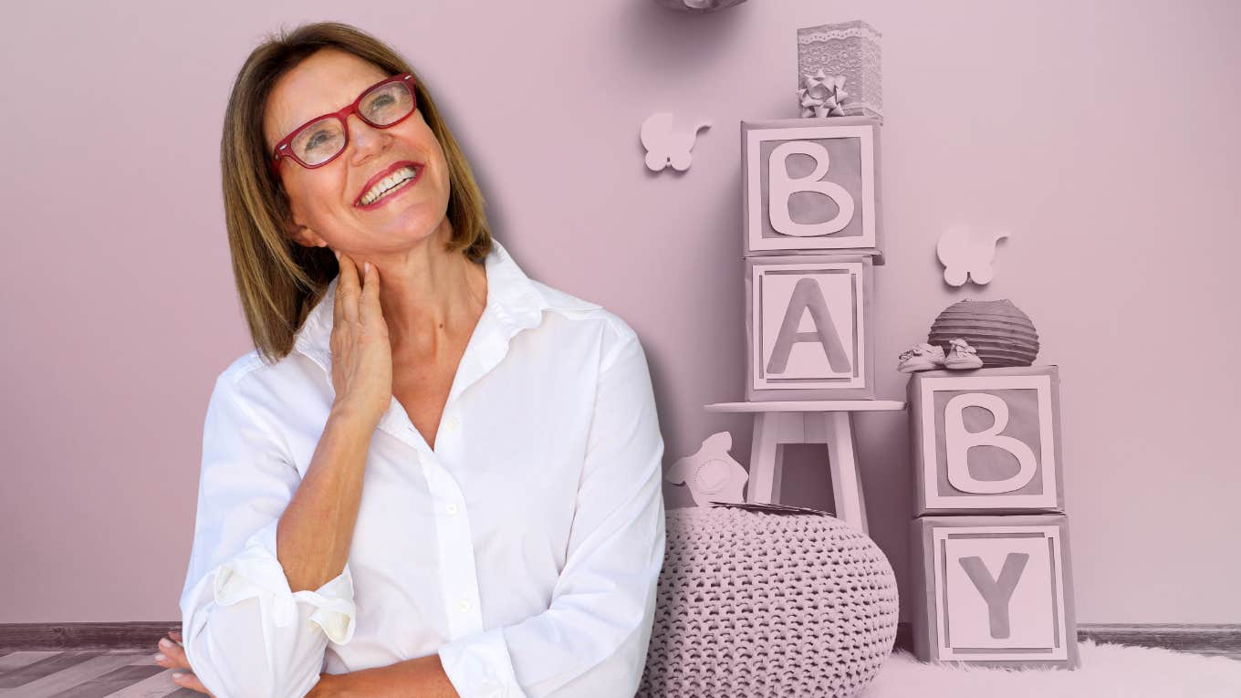 middle-aged woman in front of baby shower setup