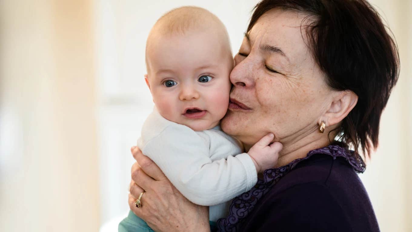 Mother-in-law holding grandson