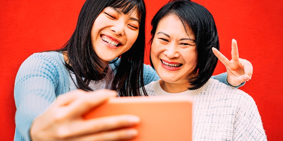 mom and daughter posing for selfie together