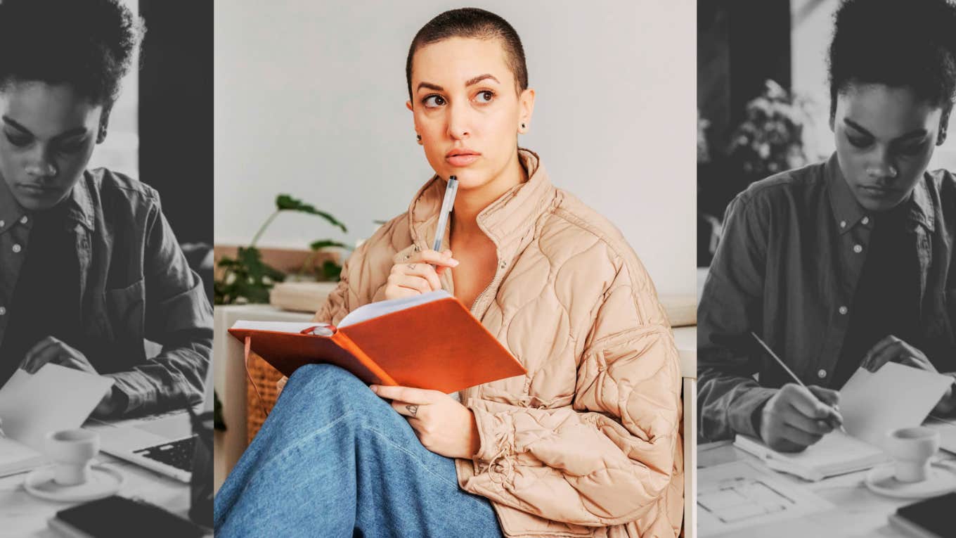 woman with book on lap, looking up