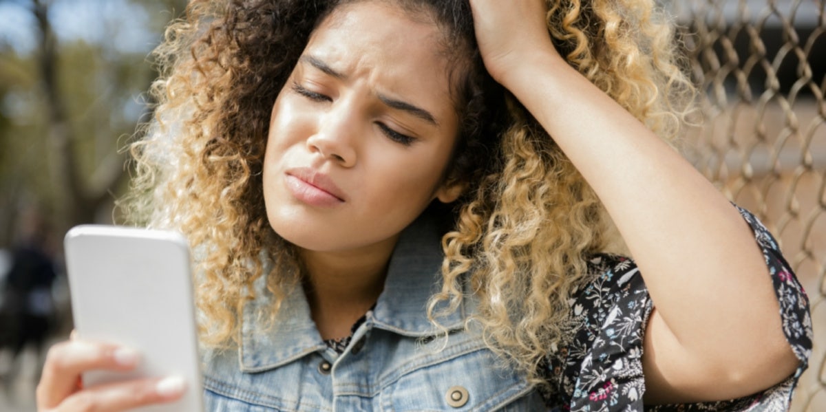 woman being bullied through phone