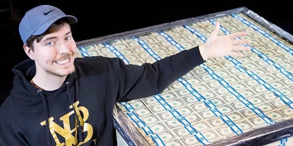 MrBeast posing with money for a video giveaway