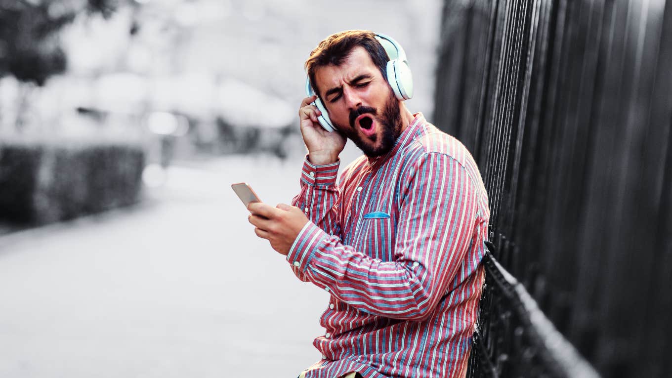 man listening to music on headphones