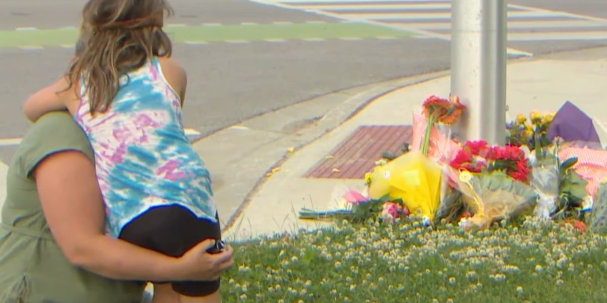 Visitors bring flowers to the site of the attack