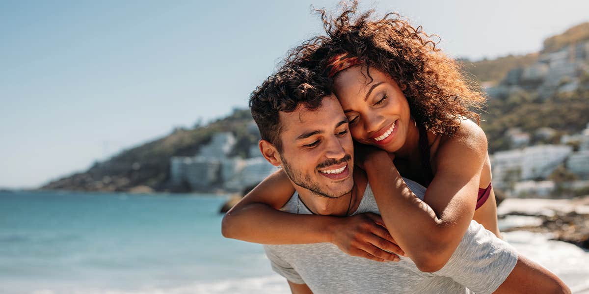 My Bisexuality Is Still Valid Even Though My Current Partner Is A Man couple on beach