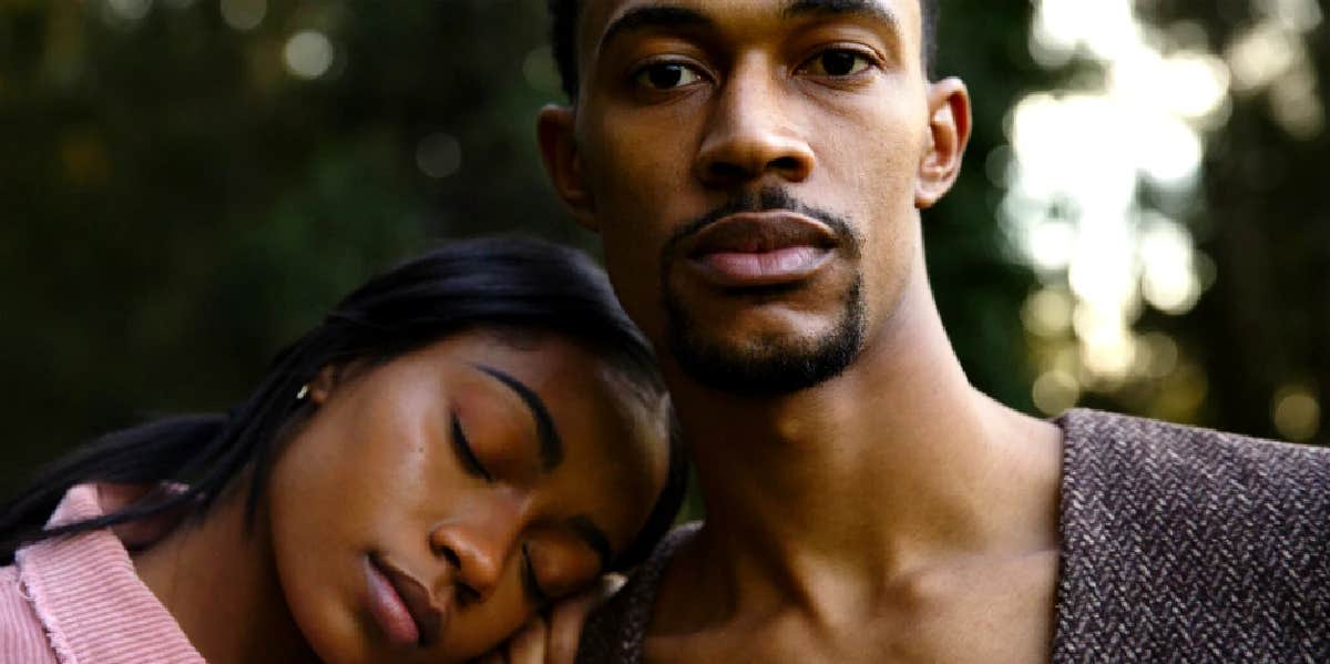 girlfriend resting her head on her boyfriend's shoulder