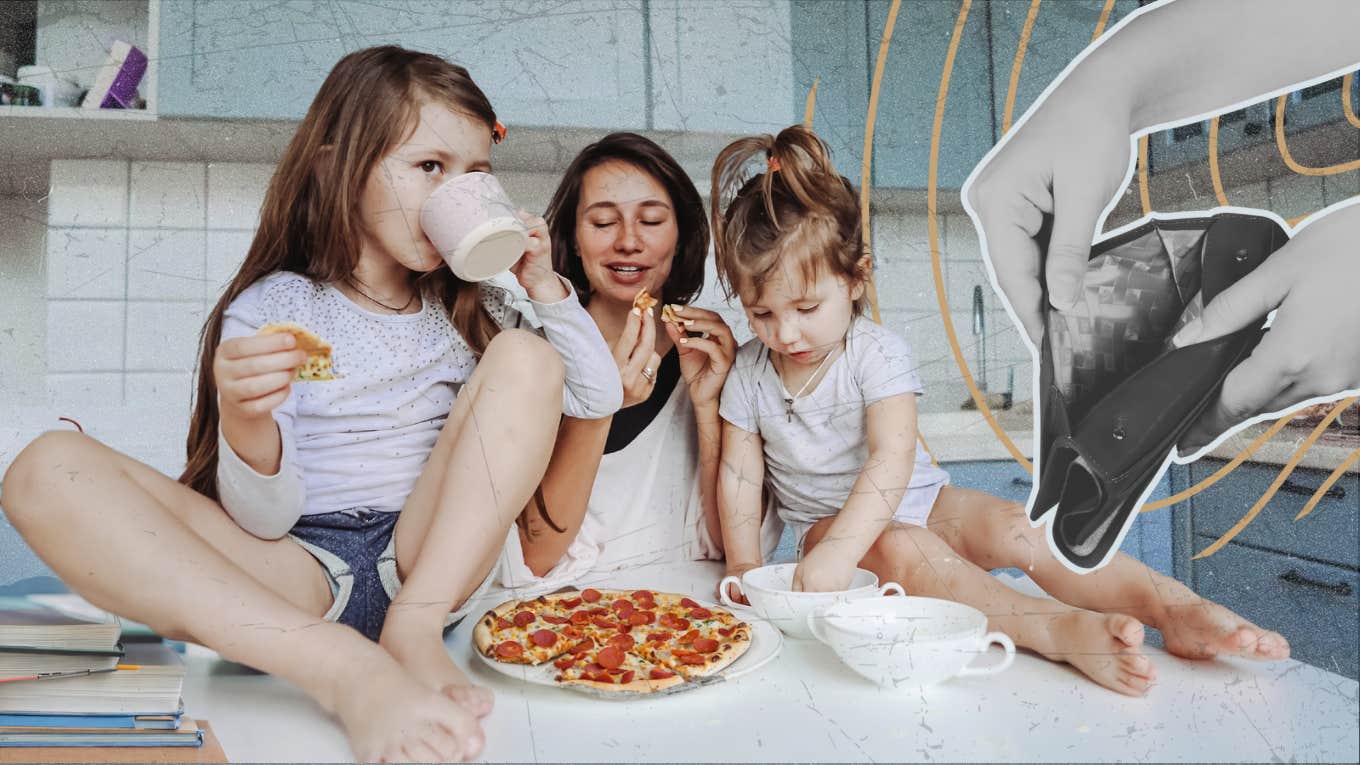Woman sitting on counter with her two daughters eating frozen pizza 