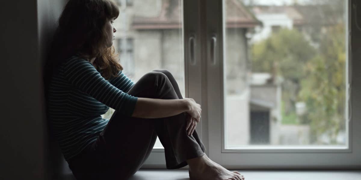 woman by window