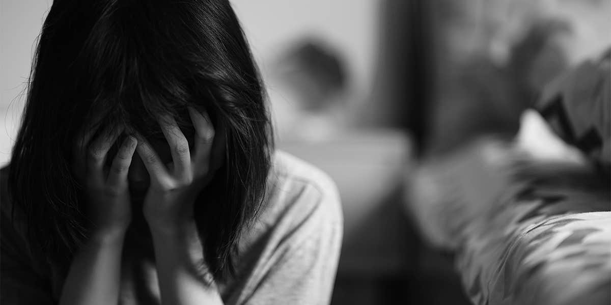 My Hardest Goodbye: Coming To Terms With Losing My Dad At 21 woman grieving and crying