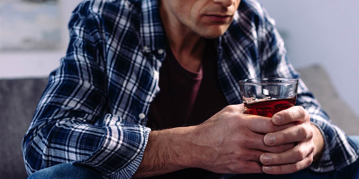 man drinking alcohol