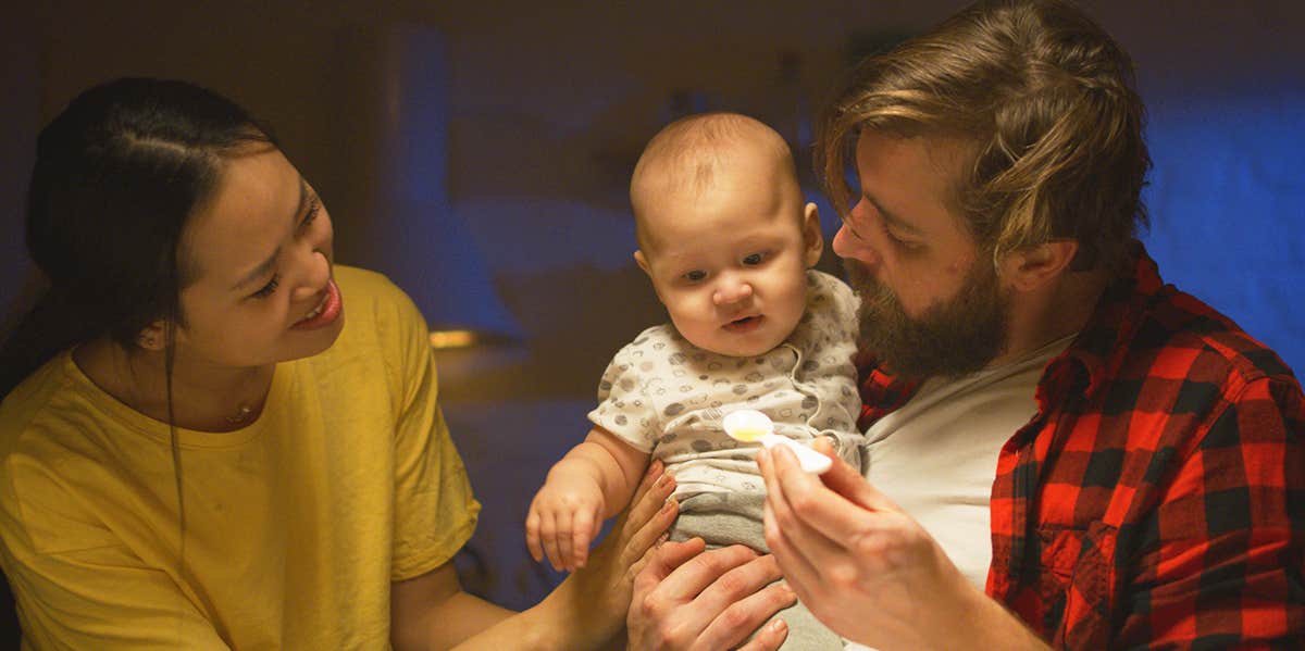 My Husband Is Dating Our Babysitter dad holding baby
