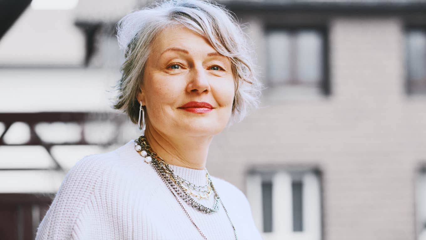 middle aged woman with greying hair and a strong stance