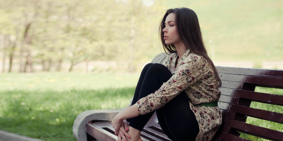 woman sitting on bench