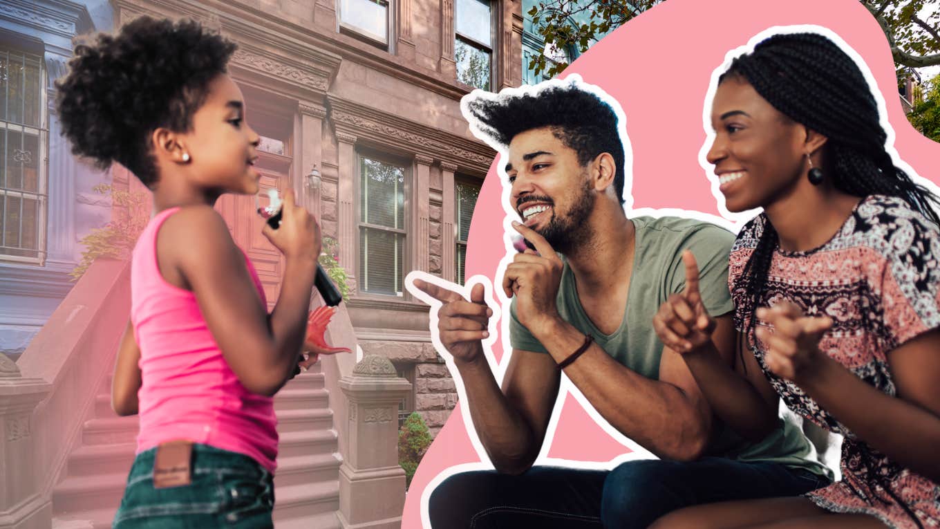 Little girl in pink hanging out on apartment steps 