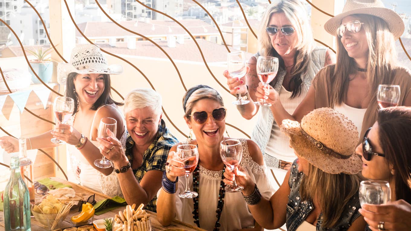 Moms drinking wine collectively having a good time 